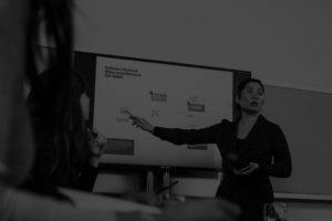 executive presentation, woman giving presentation, black and white