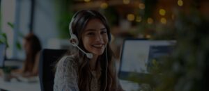 A call center agent at desk assisting customer over the phone